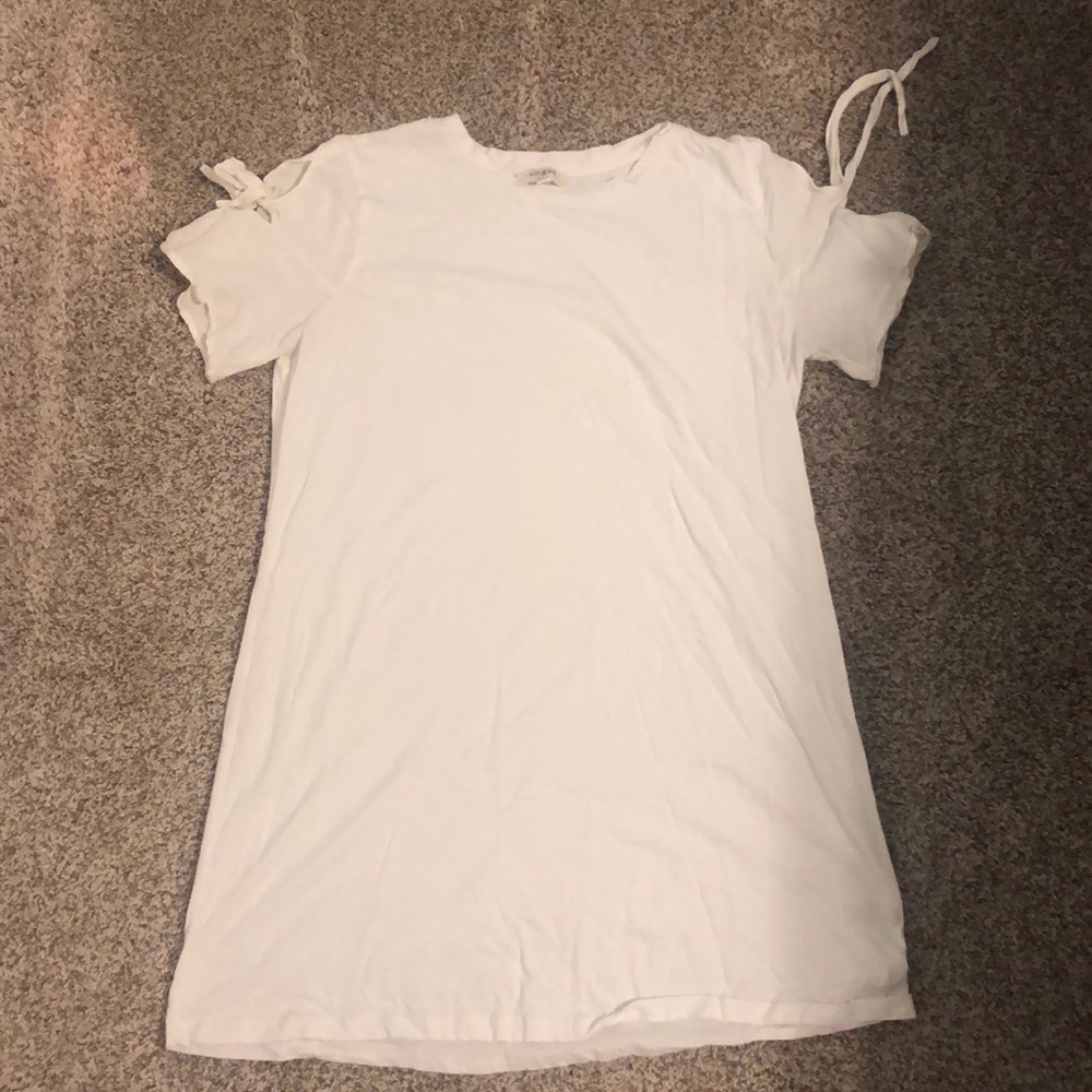 White dress with tied sleeves.